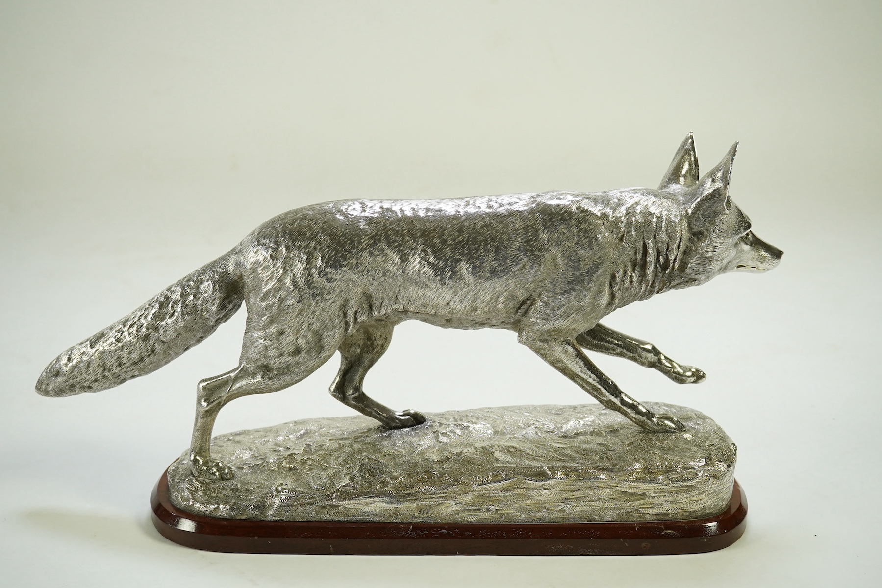 An impressive Victorian silver sculpture of a fox en passant, by R & S Garrard & Co (Robert Garrard II)